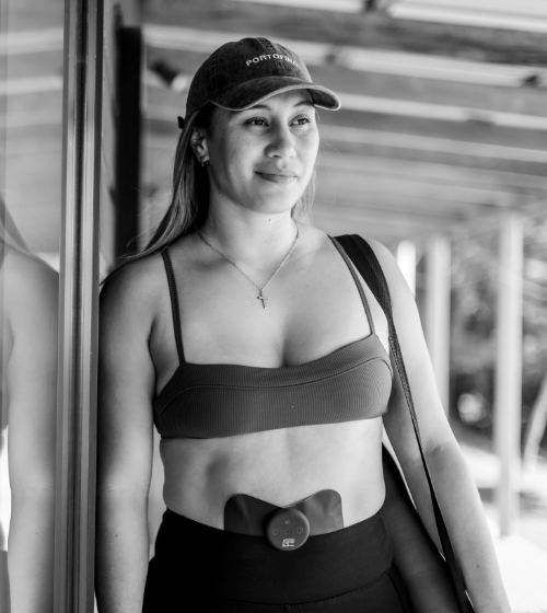 Relief Pro black TENS pad worn on lower abdomen.