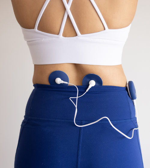 Relief Pro blue TENS pads placed on lower back.